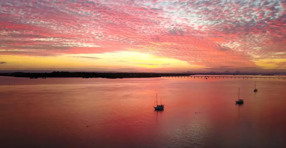 Sunset over Pumicestone Passage on Bribie Island during a Brisbane day trip.